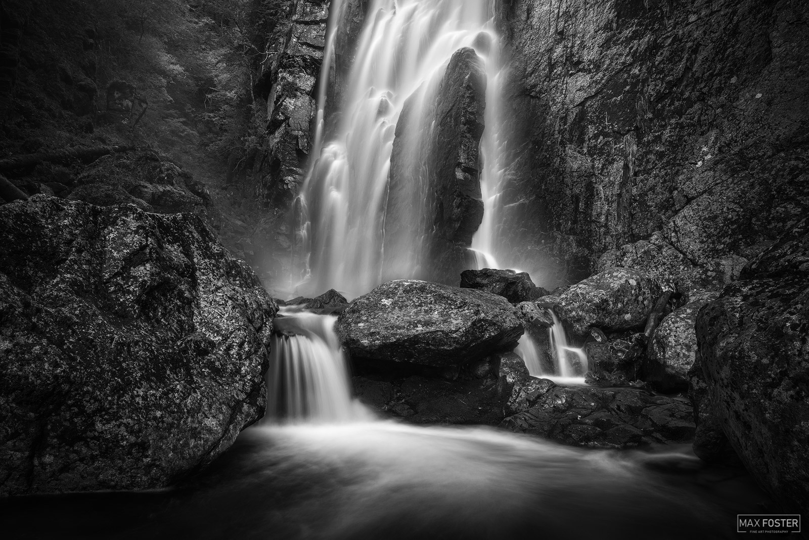 Elevate your space with Fountain Of Life, Max Foster's limited edition black & white photography print of Rainbow Falls in the...