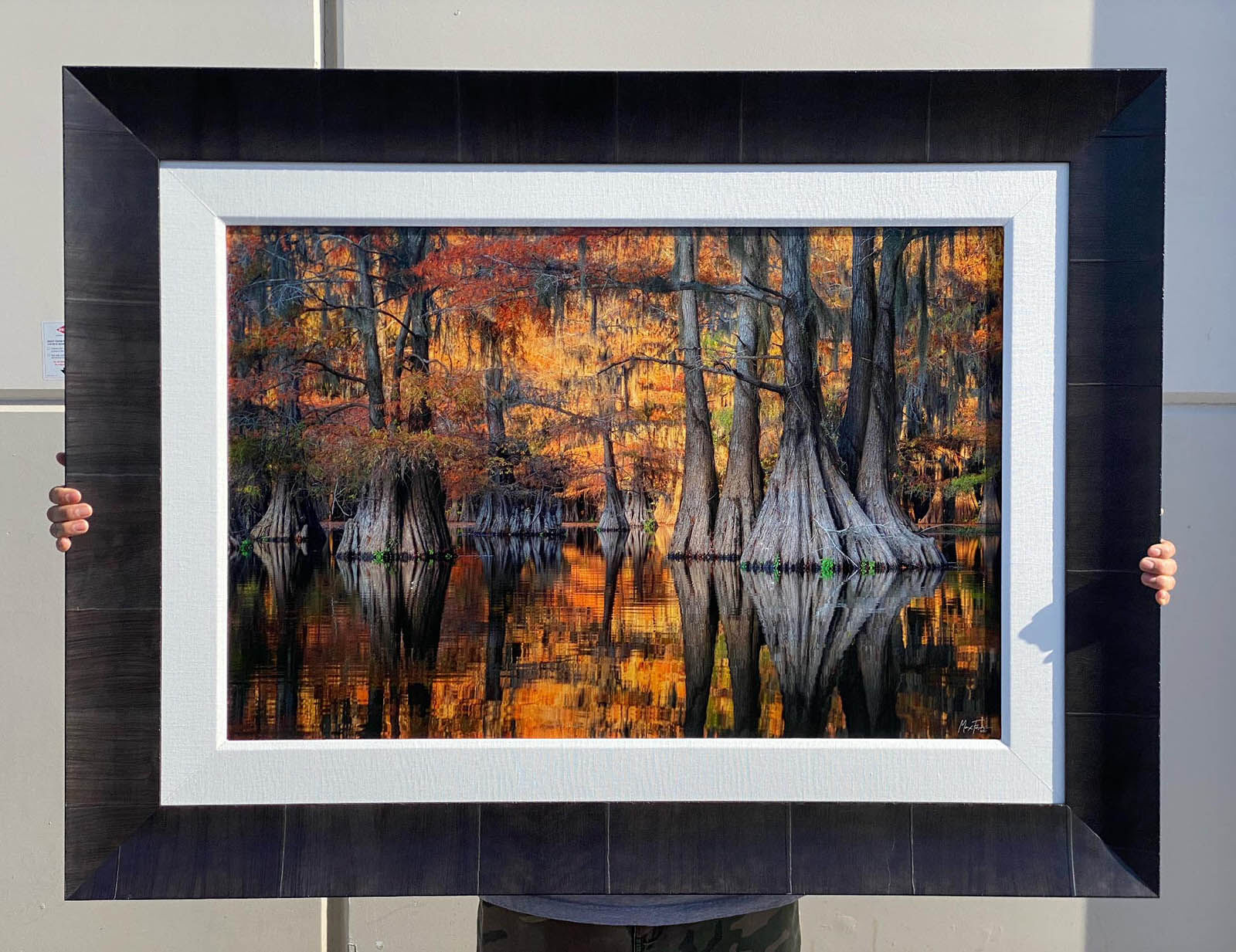 A 24x36" Gallery Ultra+ Trulife Acrylic Print of "Golden Glory" with a Tabacchino Dark Ash frame and white liner.